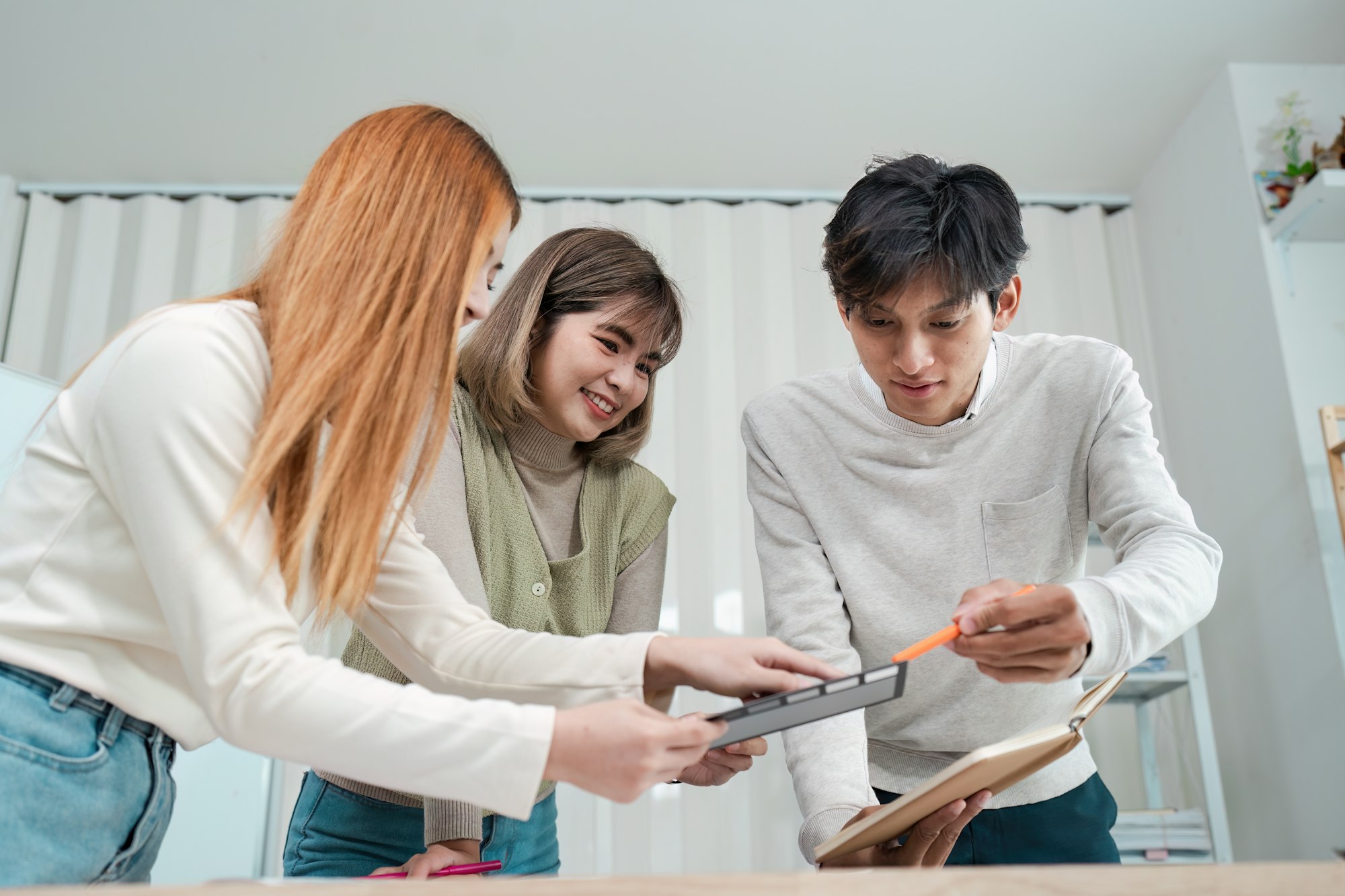 Asian business creative team work together, mobile application software design project. Brainstorm